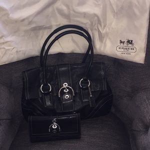 Black leather coach set with silver buckle accent